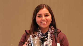 Maria Patino with the “Cream of the Crop” trophy from Hilmar