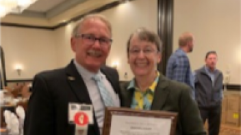 Dr. Bradley receives the “Good Egg” award. With Committee Member, Jeff Meyer.